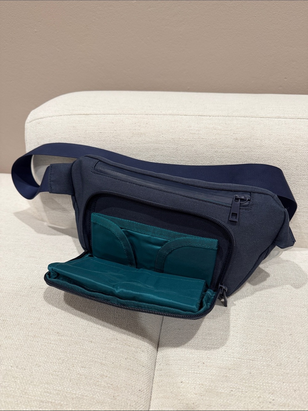Kibou travel diaper bag (fanny pack) in navy with fold-out diaper changing pad